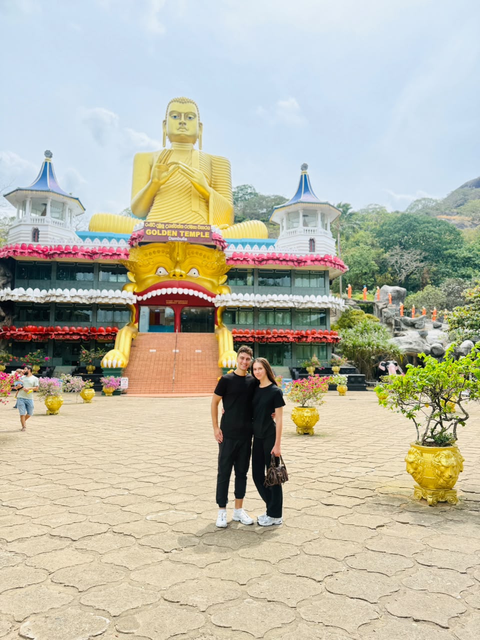 Travellers visiting Dambulla Cave Temple during a Sri Lanka cultural tour