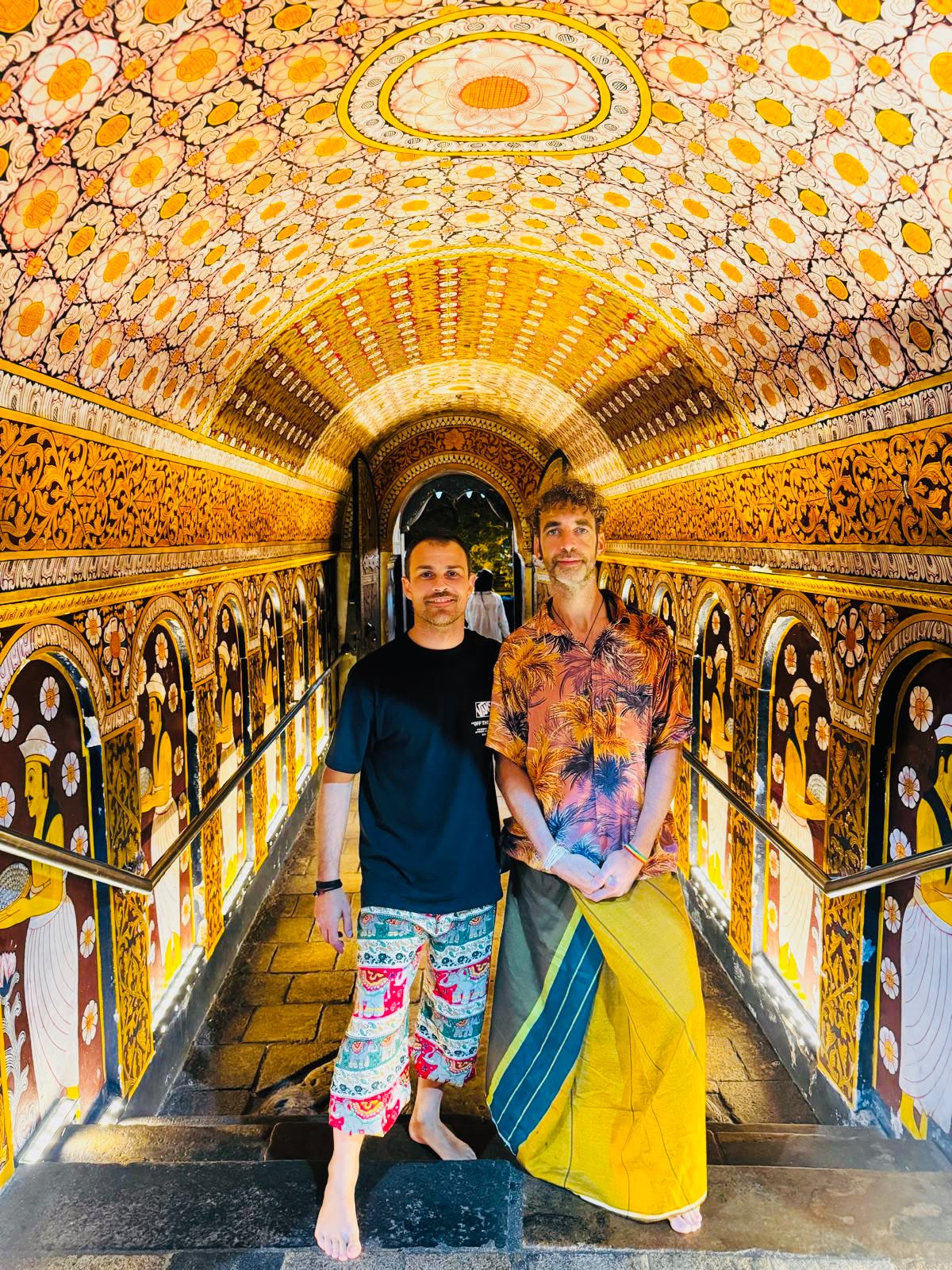 Travellers visiting the Temple of the Tooth in Kandy Sri Lanka